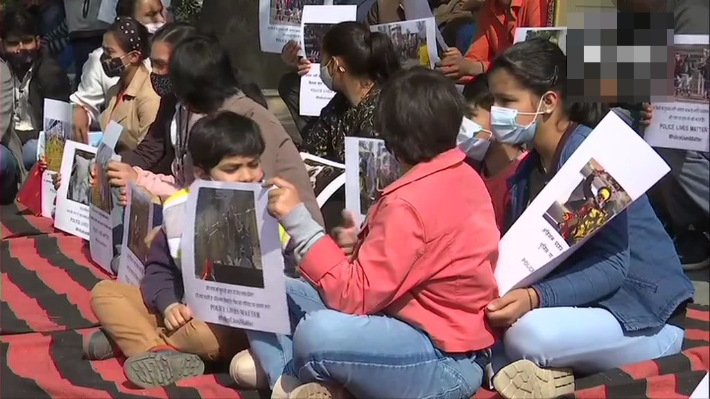 families of Police personnel who were injured in the tractor rally violence during stage a demonstration