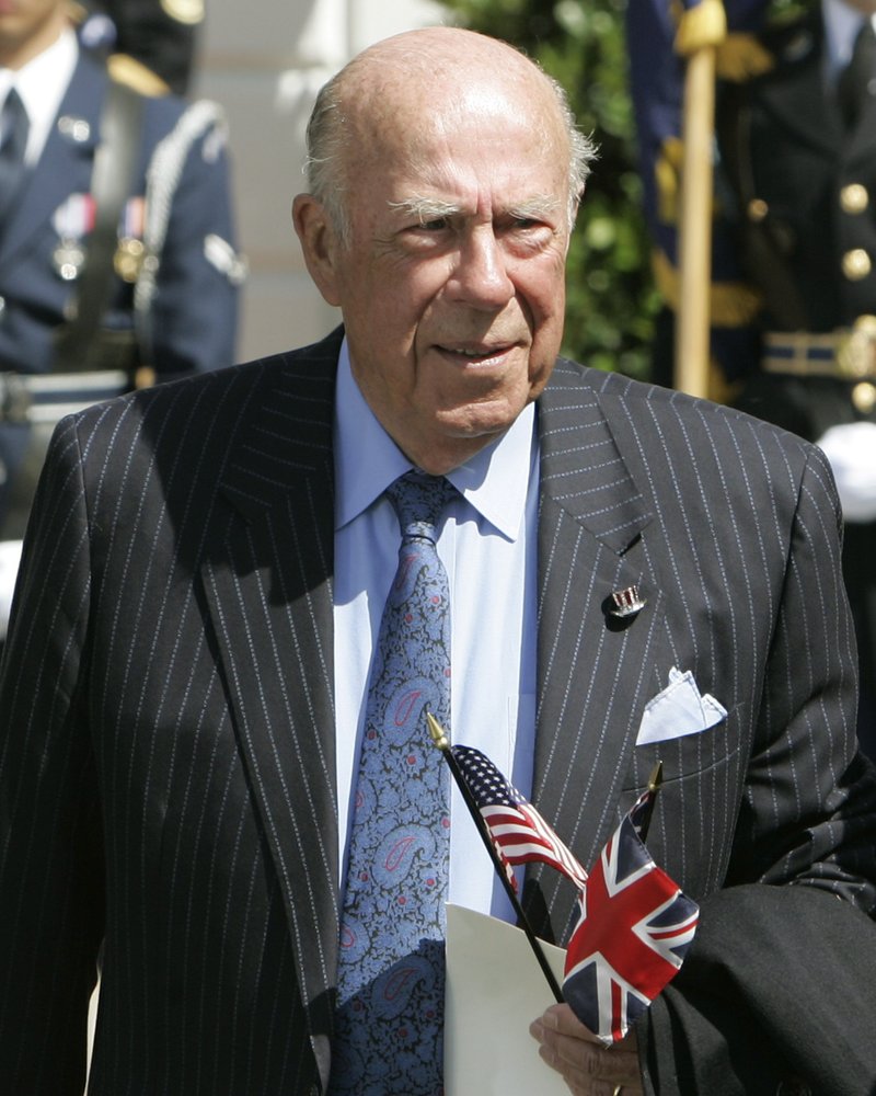 In this May 7, 2007 file photo, former Secretary of State George Schultz arrives to watch Queen Elizabeth II take part in arrival ceremonies on the South Lawn of the White House in Washington.