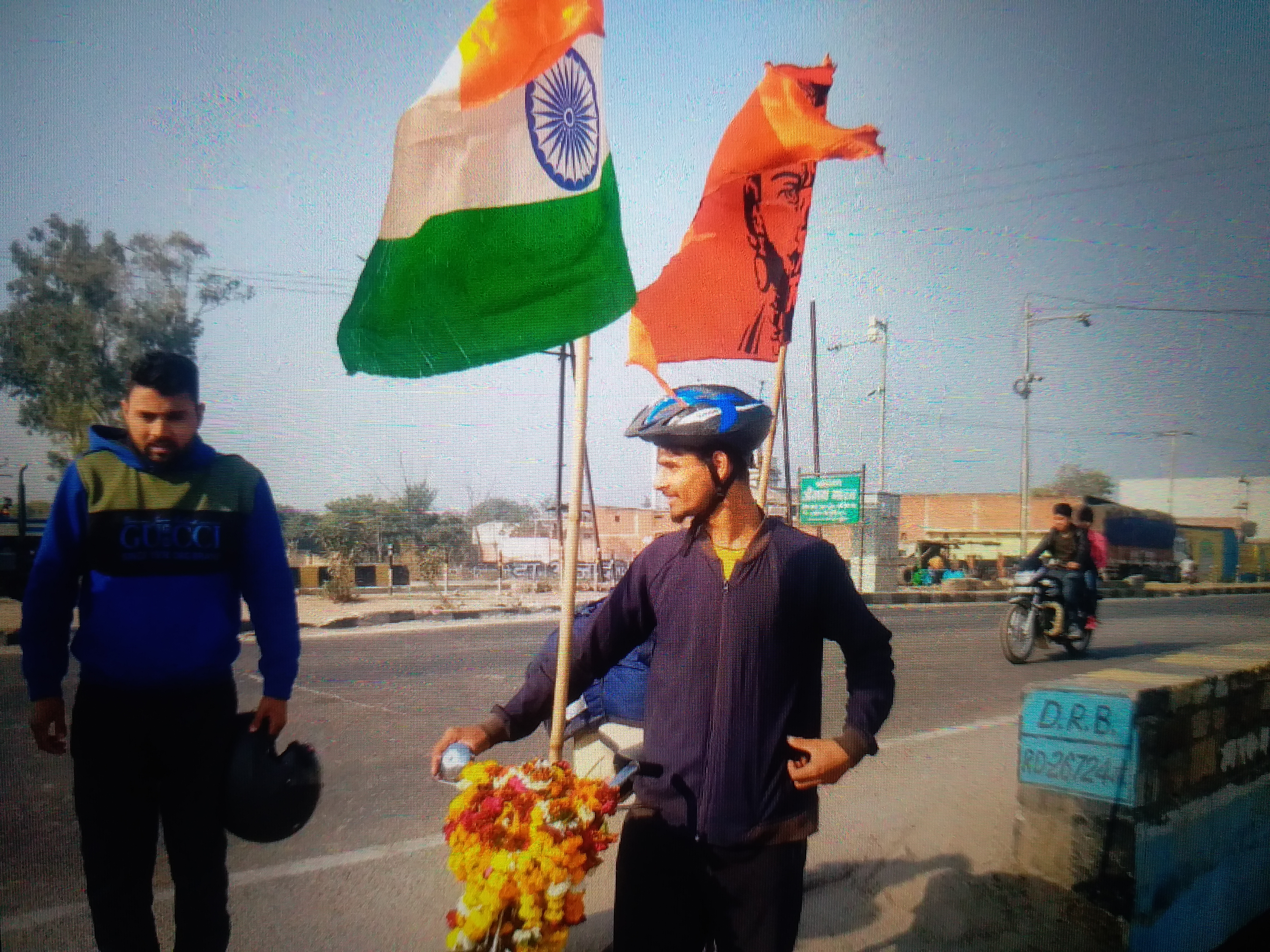 Govind with tricolor and saffron flag