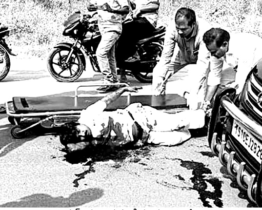 G Vaman Rao lying on the road