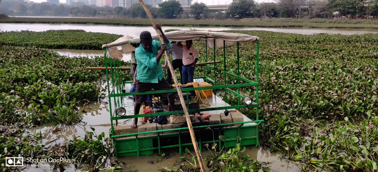 Officials from fisheries and FRIC inspect the weed harvester machine developed by fishermen