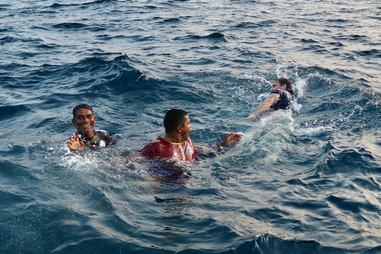 Rahul Gandhi swimming in the sea with fishermen