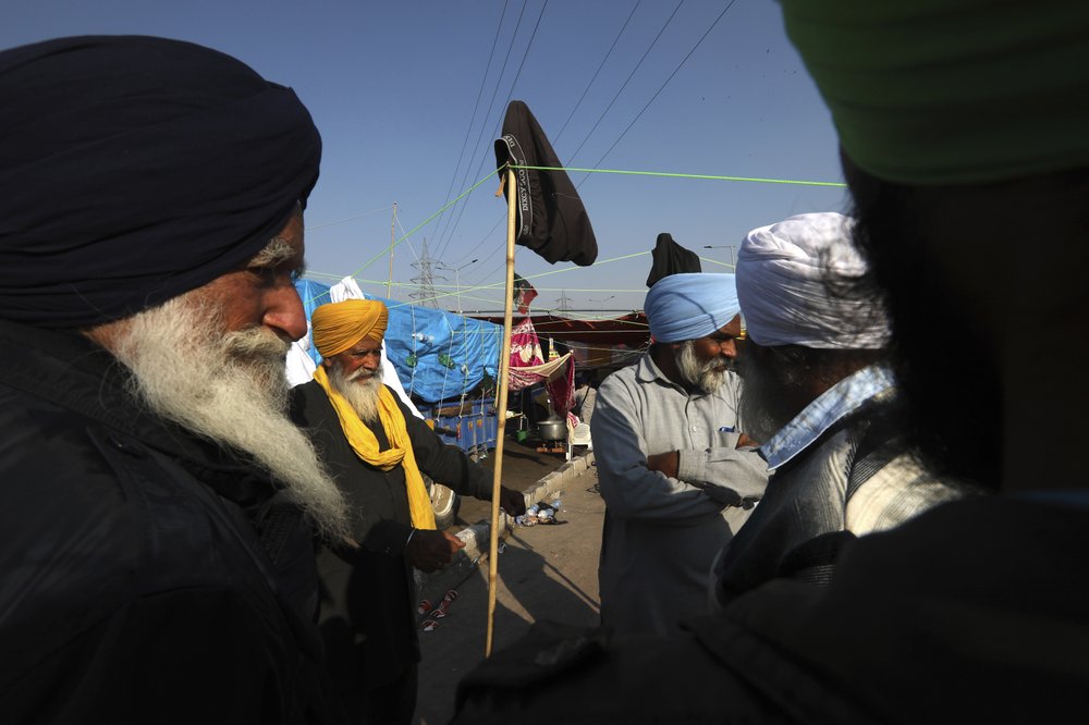 Protesting farmers camp on a highway at the Delhi- Uttar Pradesh border