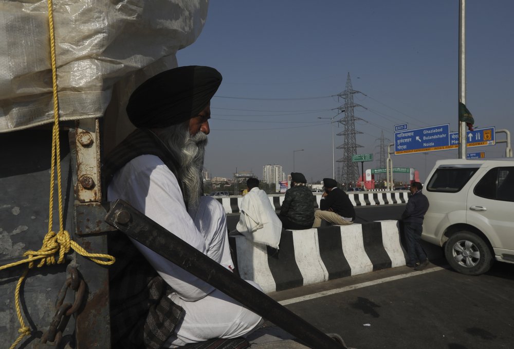 Protesting farmers camp on a highway at the Delhi- Uttar Pradesh border