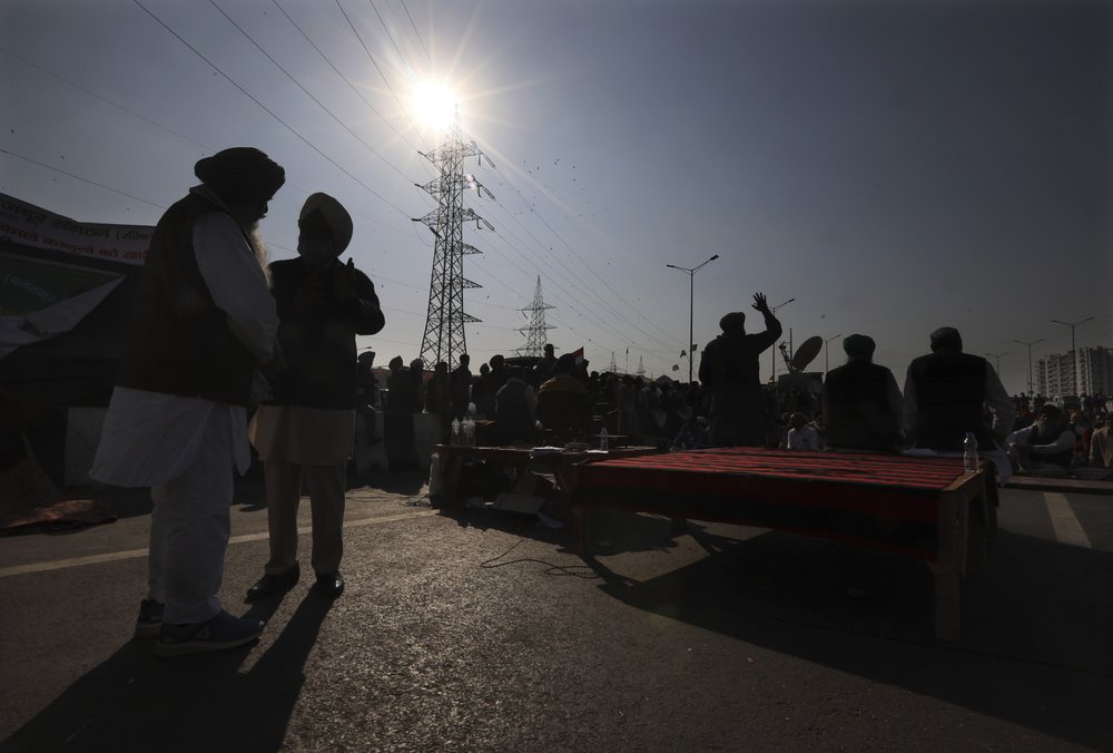 Protesting farmers camp on a highway at the Delhi- Uttar Pradesh border