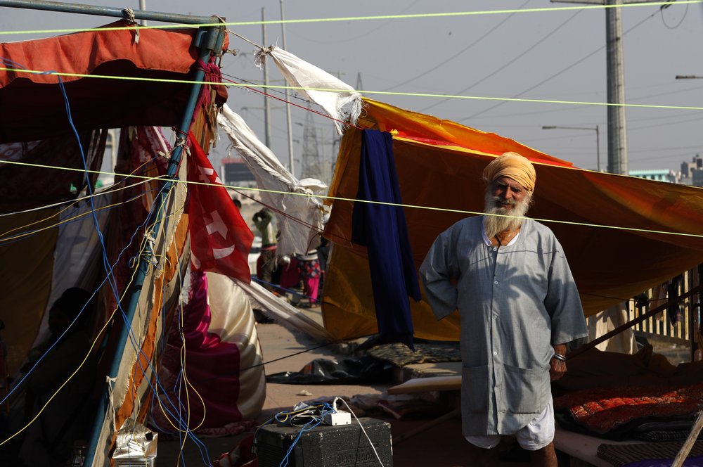 Protesting farmers camp on a highway at the Delhi- Uttar Pradesh border