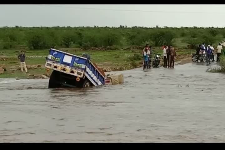 Shedding tractor in the drain while crossing the bridge