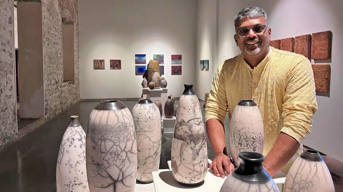 Artist Sandeep Manchekar with his exhibition at Nine Fish Art Gallery