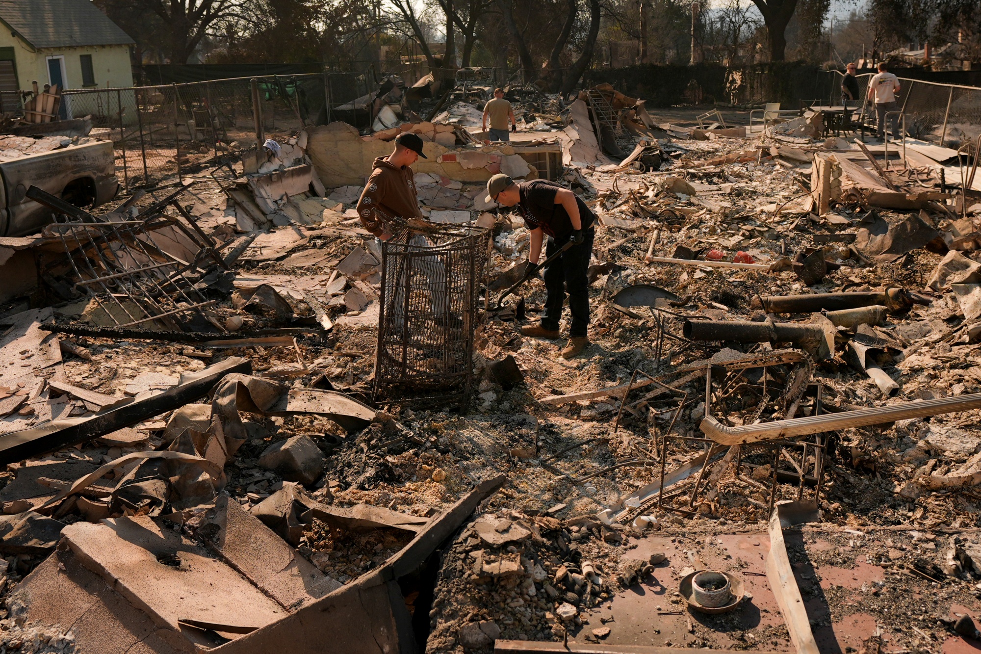 California Wildfires Homes Still Soldering Families Return To Search Ruins For Memories