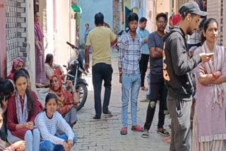 Locals gather outside the residence of drowned Kanpur youth