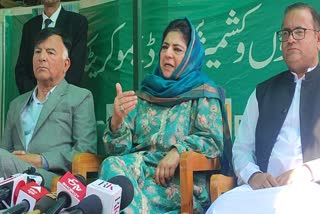 PDP President Mehbooba Mufti (C) addressing a presser along with party workers