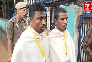 Two brothers at the polling station two days after their mother's death in Nagaon