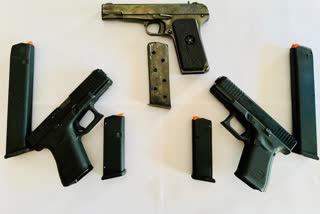 Two arrested including three pistols