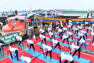 yoga-asanas-on-boats-on-the-banks-of-krishnamma