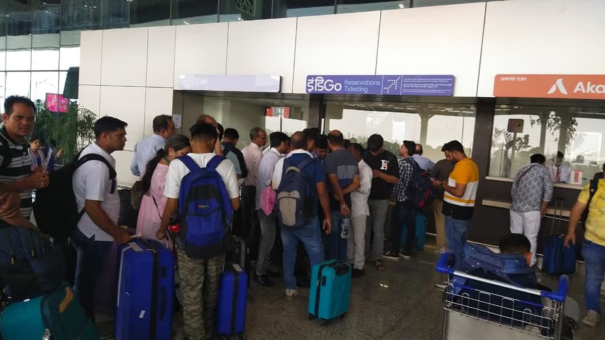 Passengers queue up to board flight at Uttar Pradesh airport