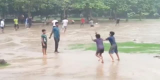 Children play in Delhi rains which bring relief from heat