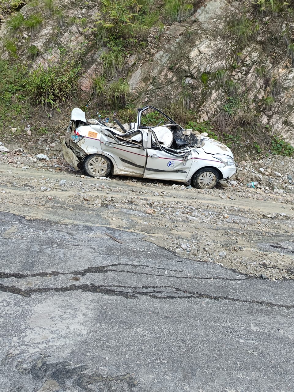 A car got hit by debris near Sirobgadh on Badrinath Highway