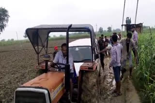 Ambulance being rescued from mud road in Bharatpur