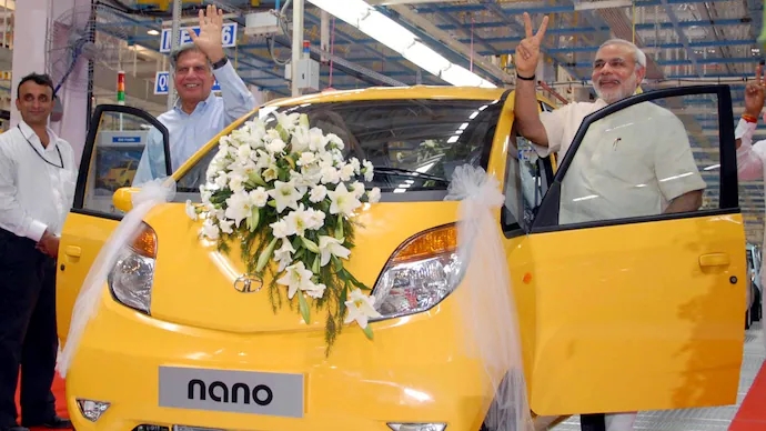 Modi and ratan tata with tata nano car inauguration function