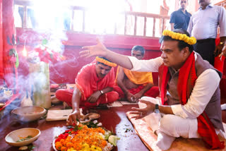 Assam Chief Minister Himanta Biswa Sarma performs rituals during his visit to a Durga Puja pandal to offer prayers on Maha Sashti, in Guwahati on Wednesday