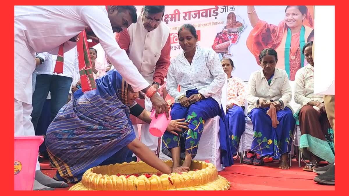 Chhattisgarh Minister Laxmi Rajwade (L) Washes Feet Of Women Sweepers On Her Birthday at the BJP office in Surajpur.