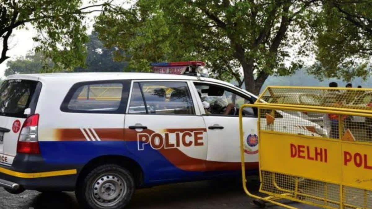 File - A Delhi Police vehicle and barricade