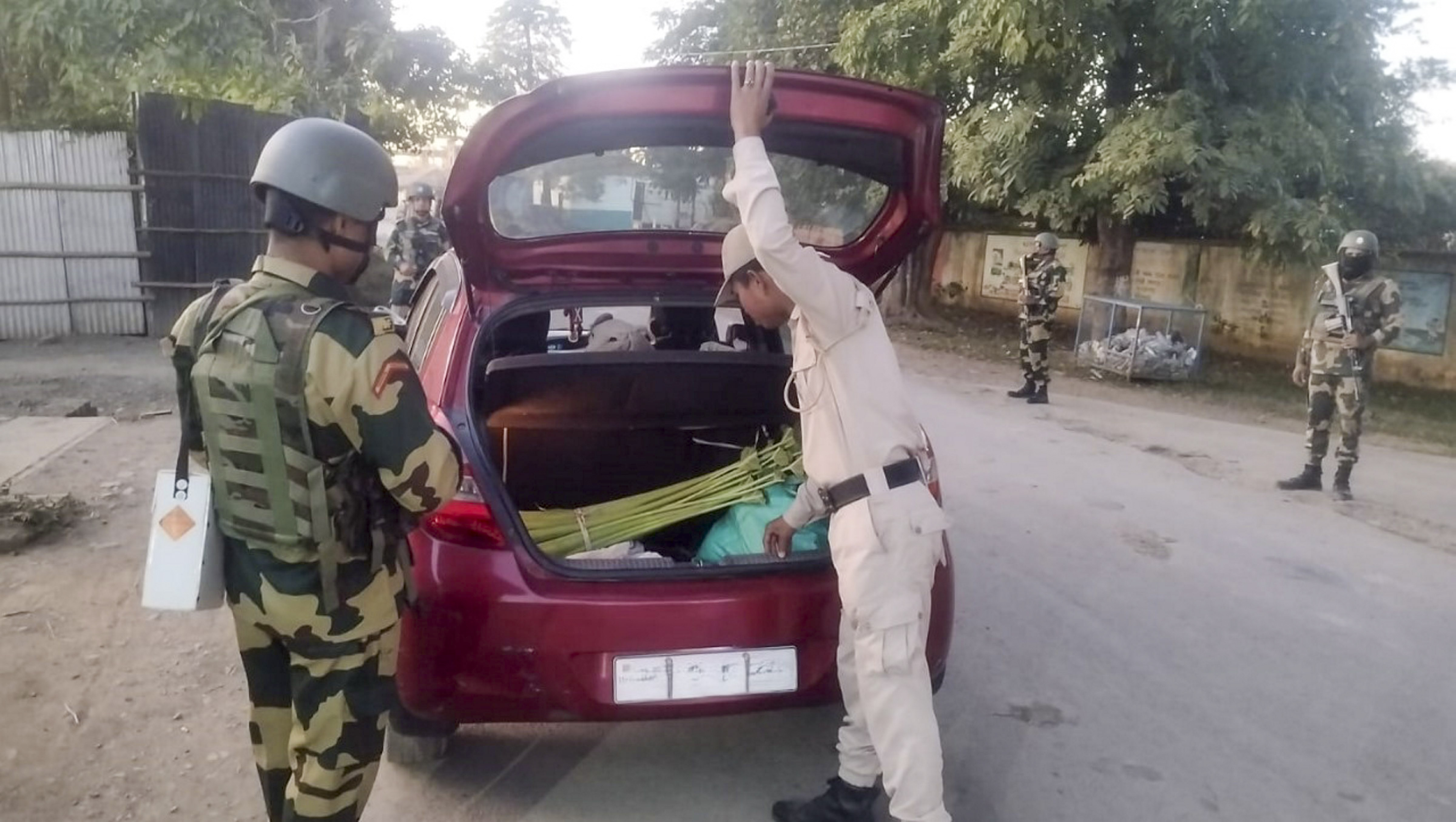 Security personnel during a search operation and area domination in the vulnerable areas of hill and valley districts of Manipur.