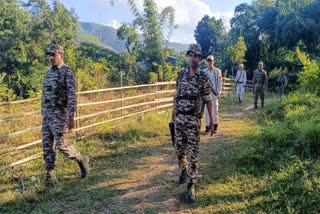 Security personnel during a search operation and area domination in the vulnerable areas of hill and valley districts of Manipur.