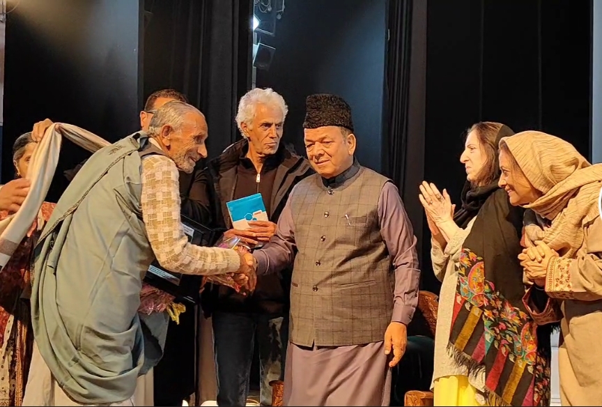 J&K Assembly Speaker AR Rather (R) shakes hands with a musician at a music event in Srinagar. The Shash Rang event was a blend of various music forms like Chakri and Rouf