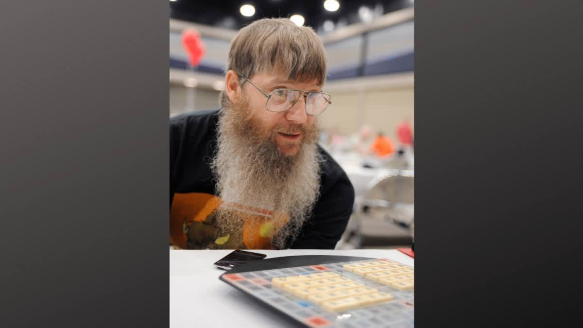 New Zealand's Nigel Richards wins Spanish Scrabble world title despite not speaking the language, relying on memorisation of the word list over a year.