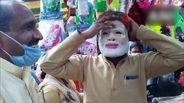 Ahead of Holi festival, shopkeepers in Aligarh say there is an increase in demand of PM Modi's plastic face mask & his beard