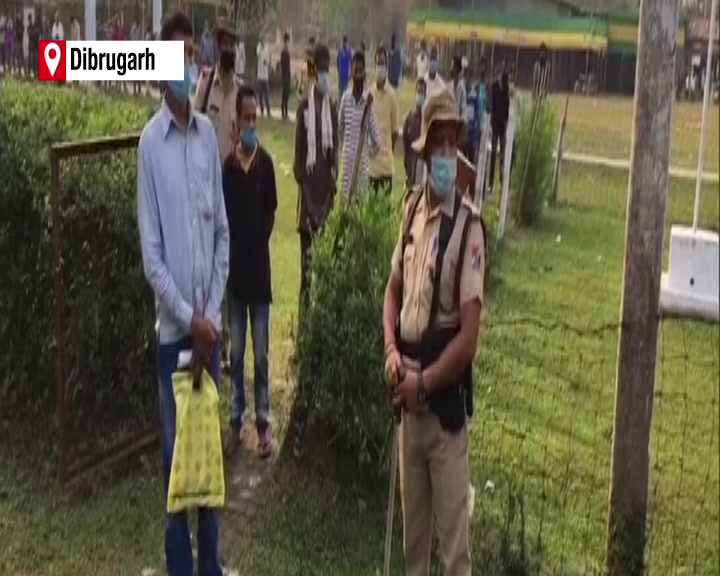 Voters waiting in a queue in Dibrugarh