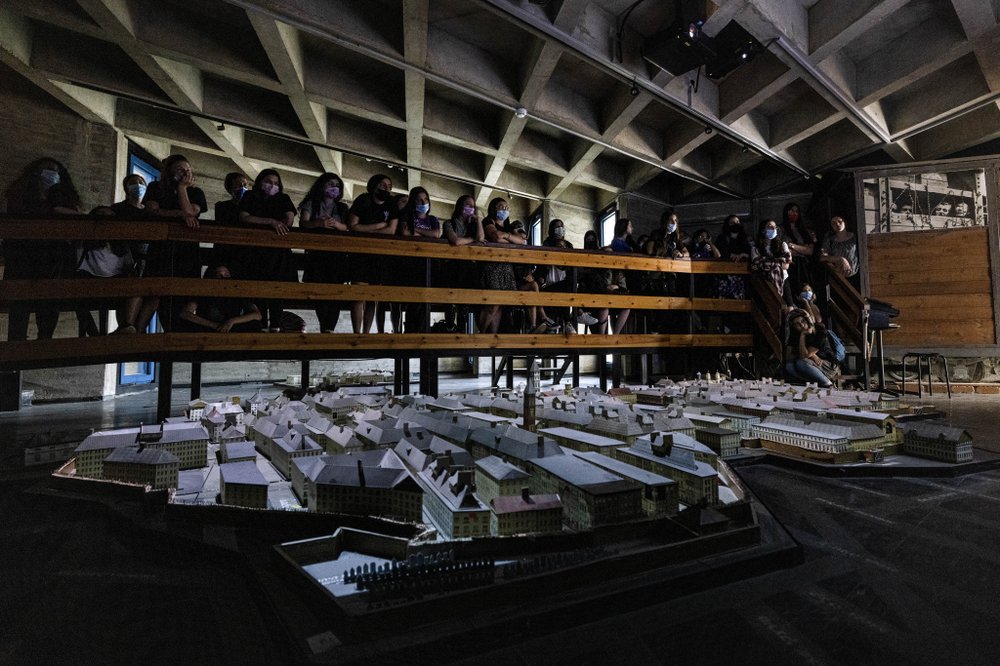 Israeli students look at a model of the Warsaw Ghetto at the museum 