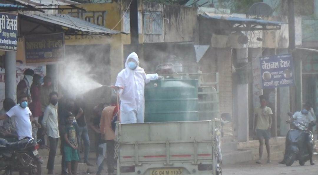 Socialist Yogesh Tiwari spraying sanitizer