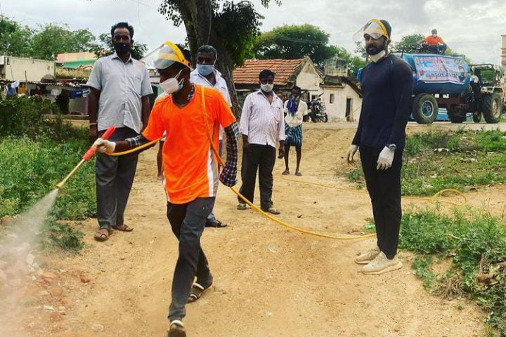 Serial Actor Harish Gowda Sanitizing in Malur village