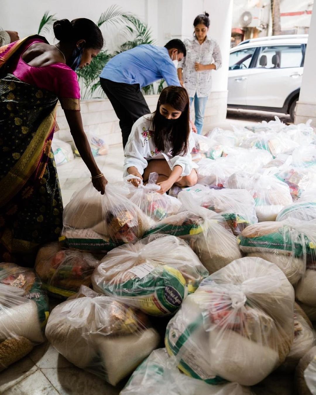 Pooja Hegde arranges food a month's rations for a 100 families