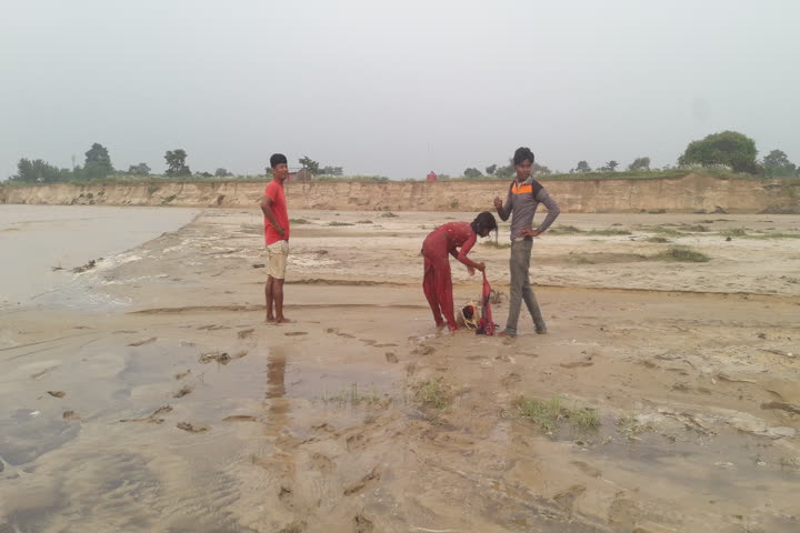 villagers save a young woman flowing in water