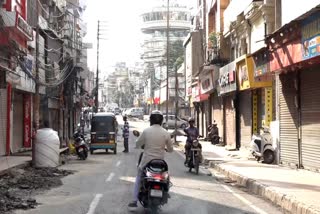 Commuters seen even as shops remain closed, a day after India and Pakistan agreed to a bilateral understanding, at Raghunath Bazaar in Jammu, Sunday, May 11, 2025.
