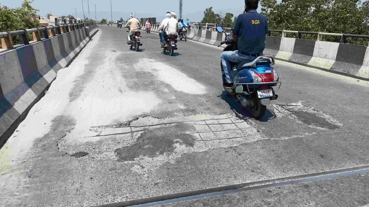 Potholes on railway over bridge in Laksar