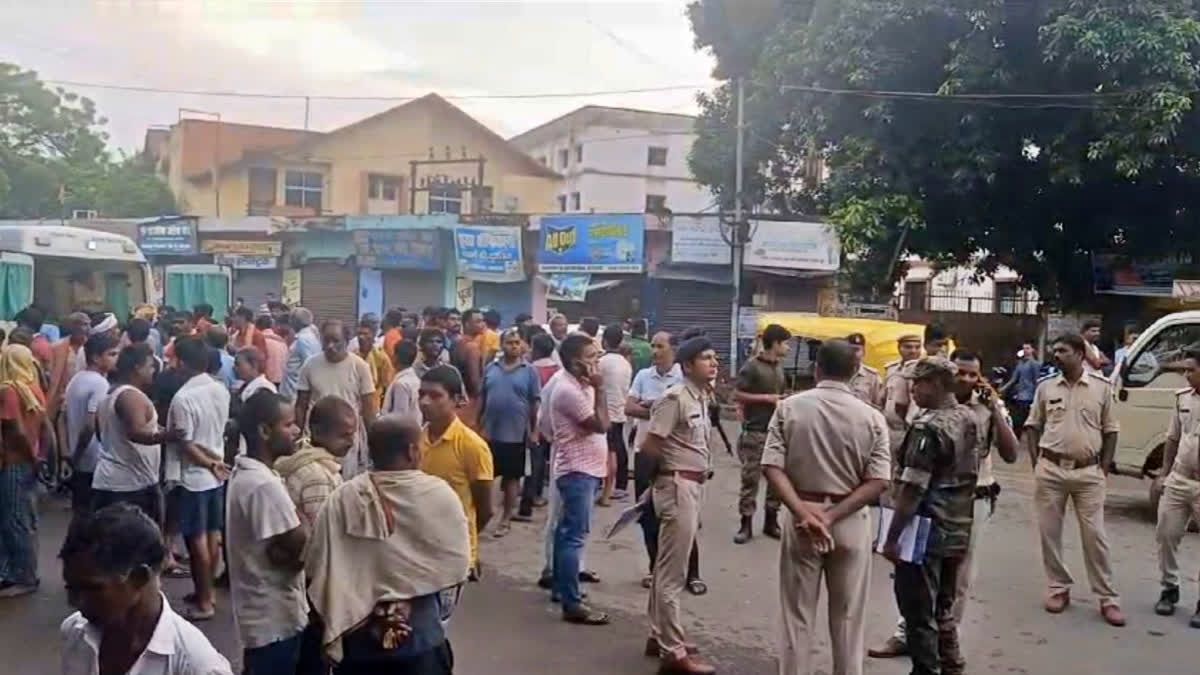 Police officials and public gather near the Baba Siddhanath Temple in Bihar's Jehanabad district where at least seven people died in a stampede during the intervening night of Sunday and Monday.