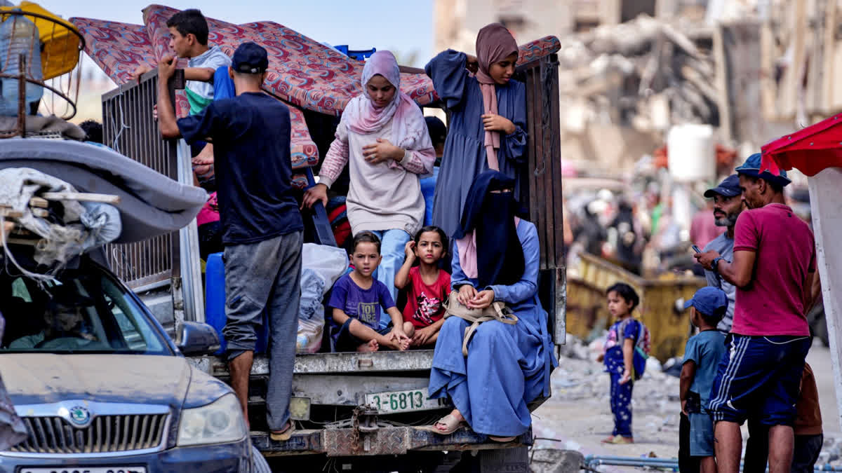 Palestinians displaced by the Israeli air and ground offensive on the Gaza Strip flee from Hamad City, following an evacuation order by the Israeli army to leave parts of the southern area of Khan Younis, Sunday, Aug. 11, 2024.