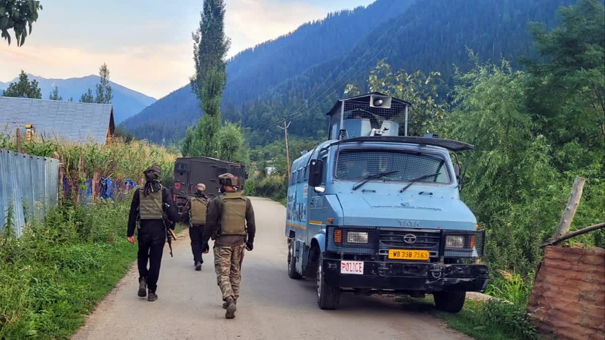 Security personnel stand guard near the encounter site in Anantnag on Sunday, Aug 11, 2024.