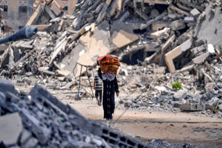 Palestinians displaced by the Israeli air and ground offensive on the Gaza Strip flee from Hamad City, following an evacuation order by the Israeli army to leave parts of the southern area of Khan Younis, Sunday, Aug. 11, 2024.