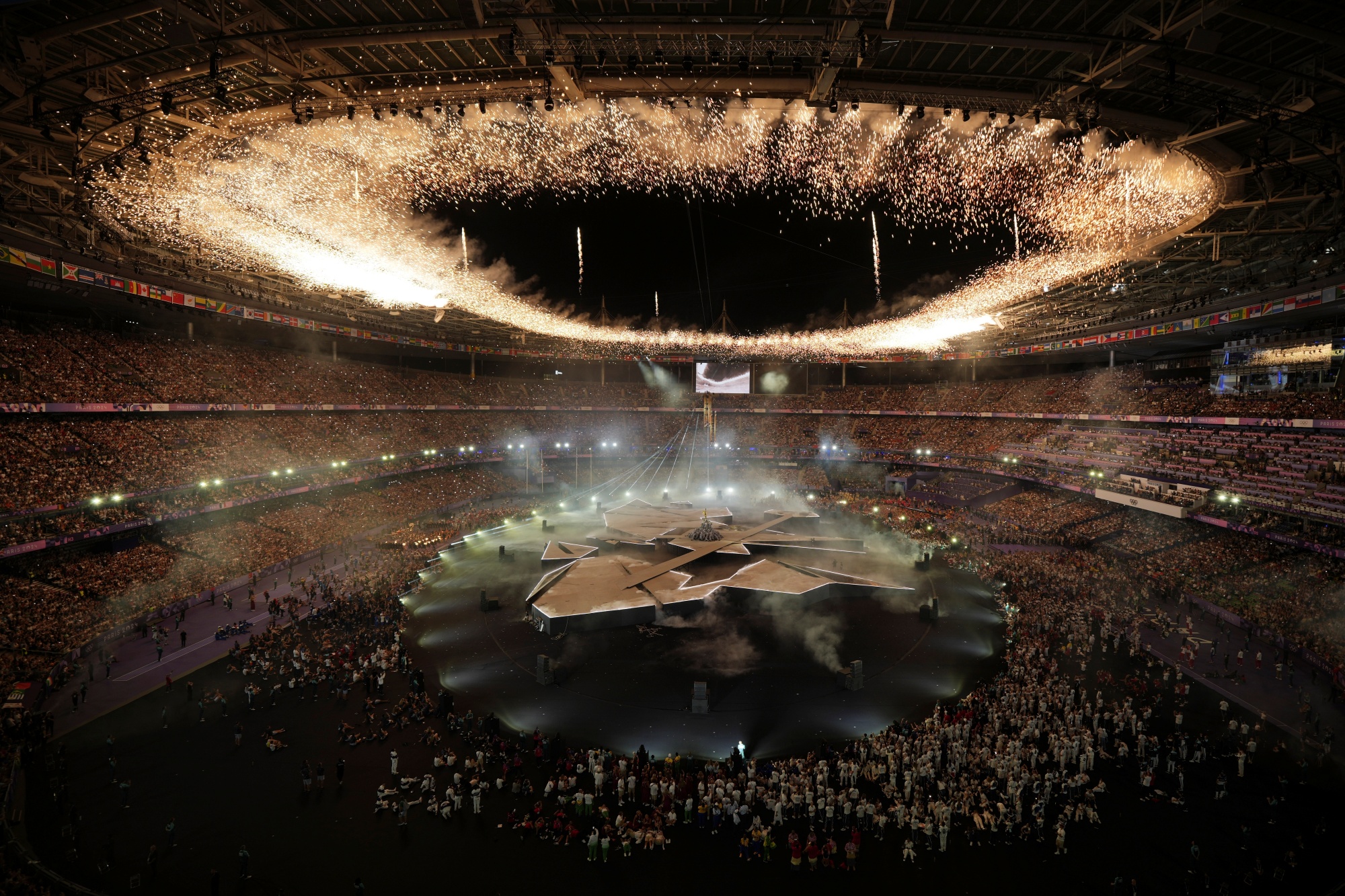 Fireworks ignite during the 2024 Summer Olympics closing ceremony at the Stade de France, Sunday, Aug. 11, 2024, in Saint-Denis, France.