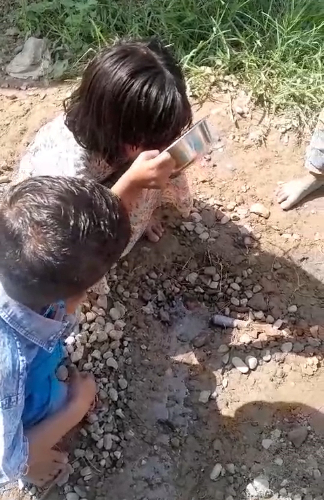 Children Drinking Dirty Water in Laksar