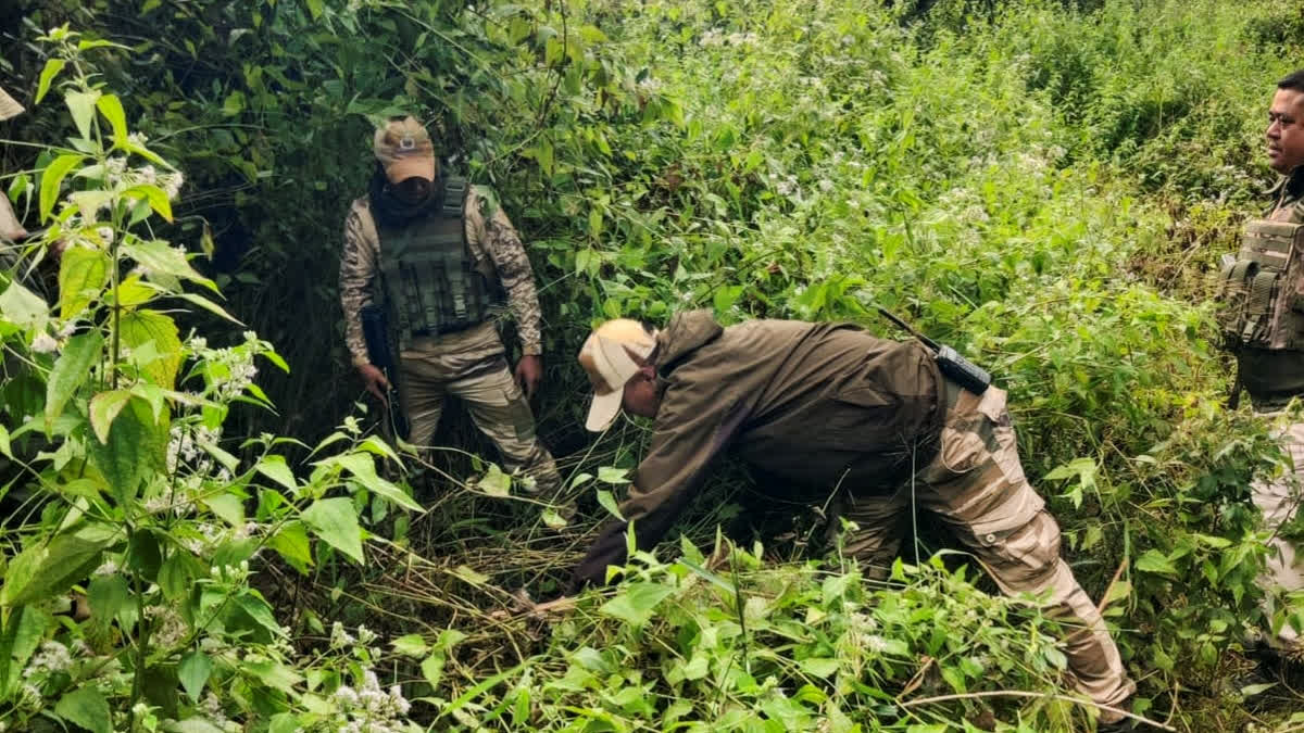 Security personnel during a search operation and area domination in the vulnerable areas of hill and valley districts of Manipur.