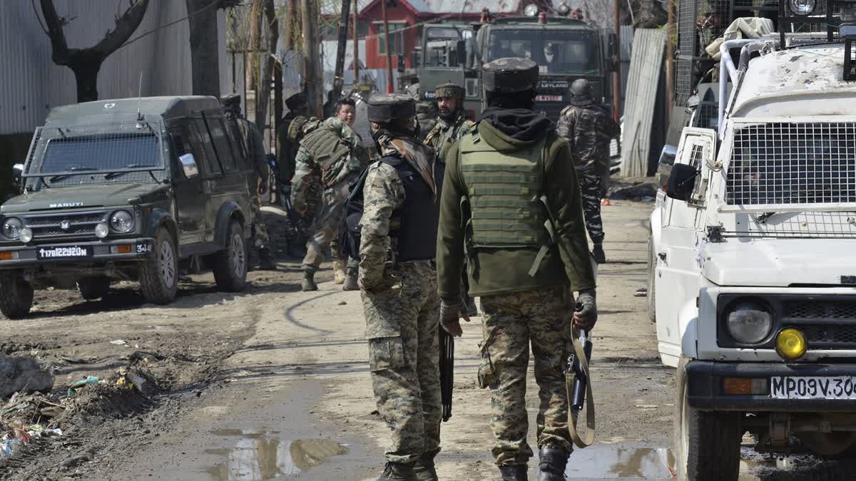 Army jawans stand guard near encounter site in Bandipora district, North Kashmir