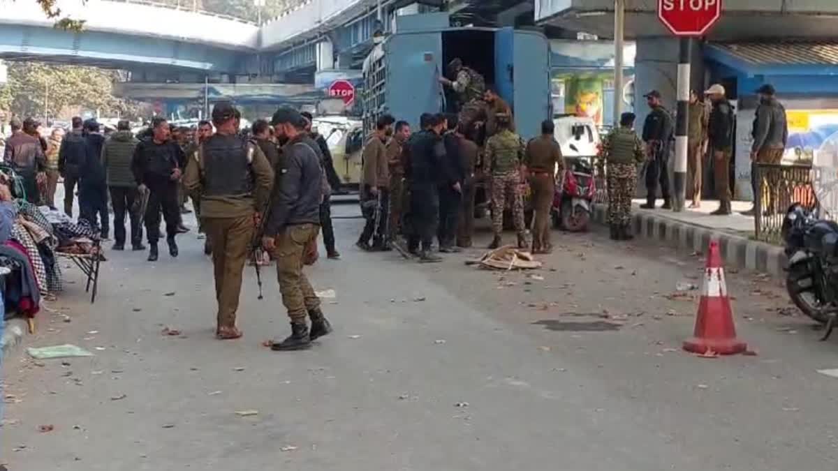 Cops examine the spot after grenade attack at Sunday market in Srinagar on Nov 3, 2024 in which 12 civilians were injured