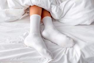 SLEEPING WITH SOCKS ON