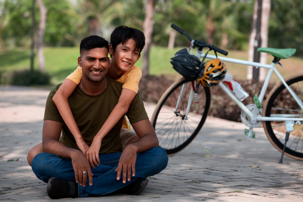 Father and son taking a break from biking